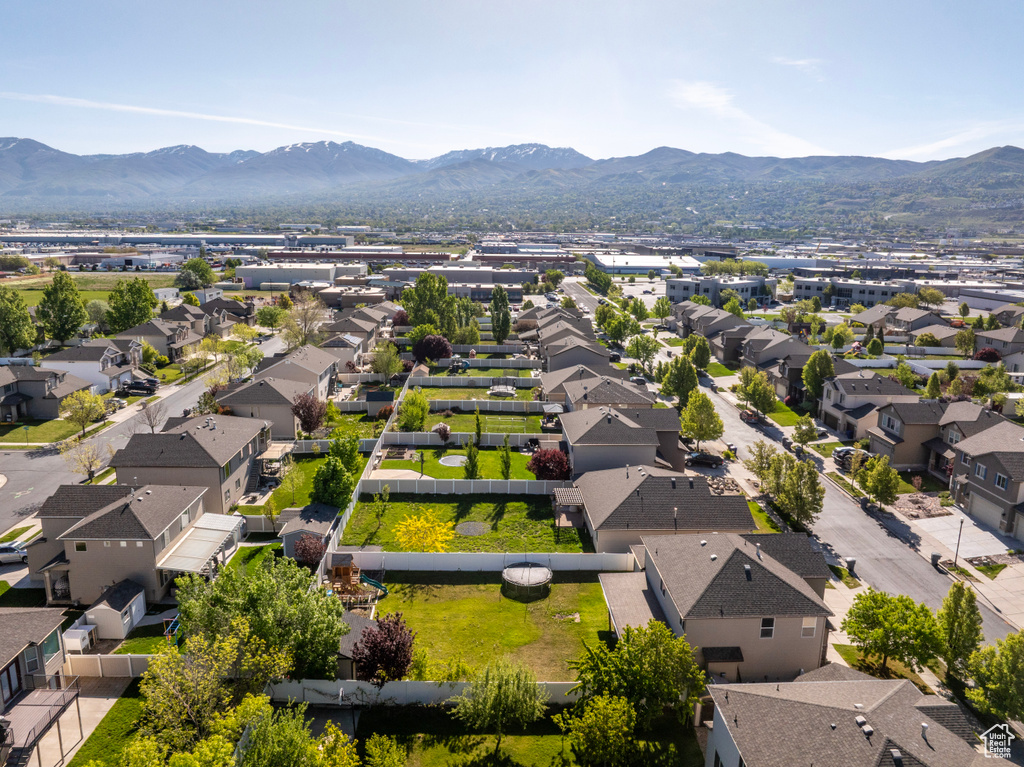 Aerial view of residential area featuring mountains