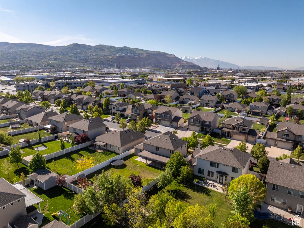 Aerial perspective of suburban area with a mountain backdrop