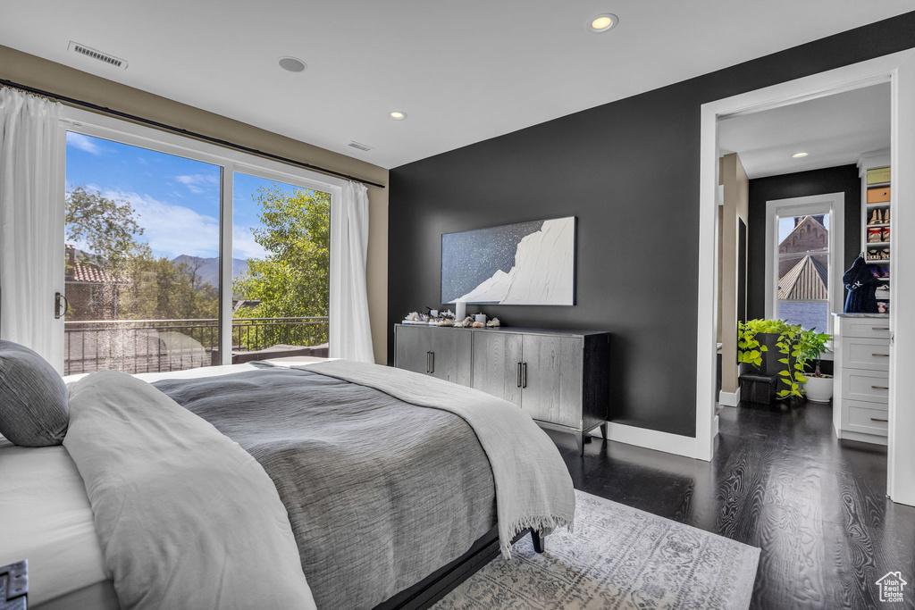 Bedroom featuring recessed lighting, wood finished floors, and baseboards