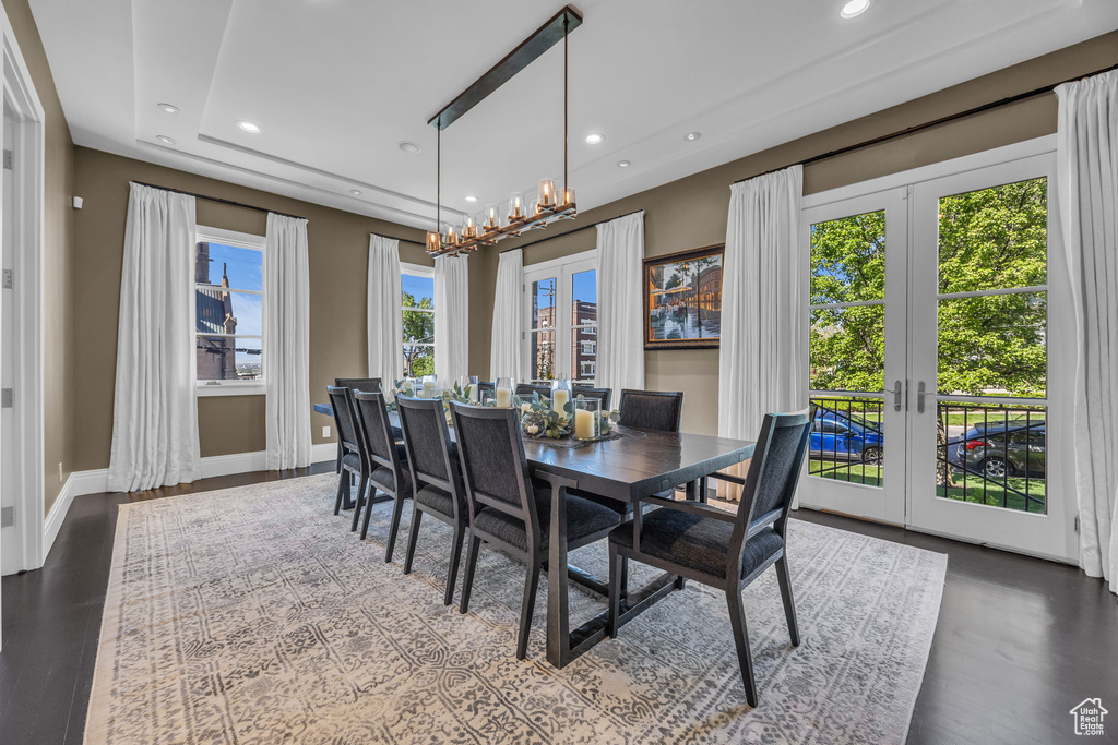 Dining room with french doors, a chandelier, recessed lighting, baseboards, and wood finished floors