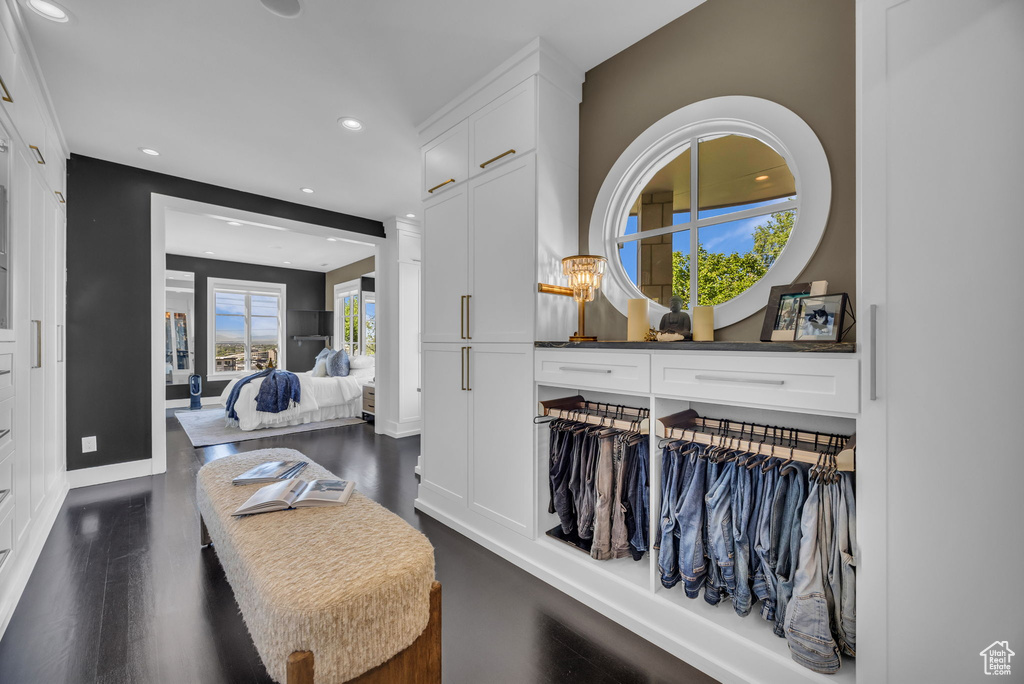 Sitting room with recessed lighting, dark wood finished floors, and baseboards