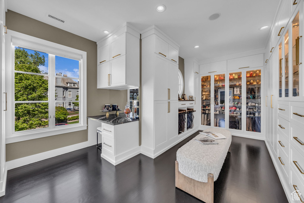 Kitchen featuring recessed lighting, white cabinets, dark wood finished floors, dark countertops, and baseboards