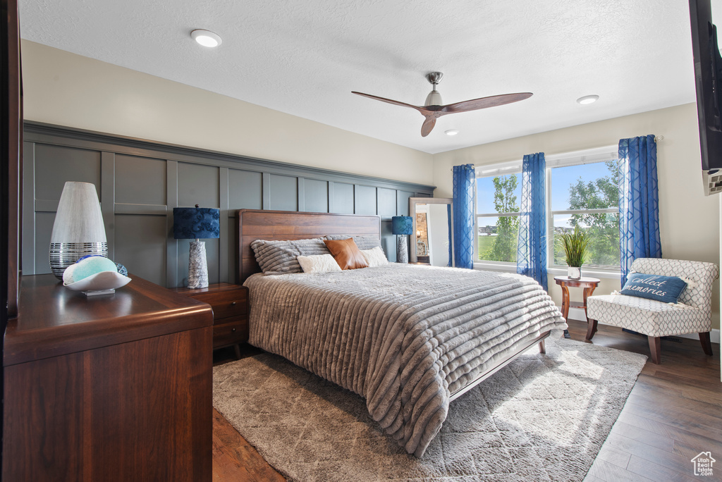 Bedroom featuring wood finished floors, a ceiling fan, and recessed lighting