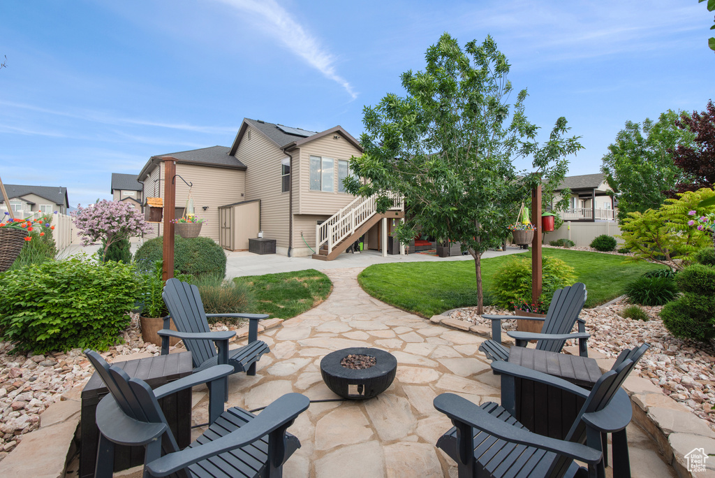 View of patio / terrace with a fire pit and stairs