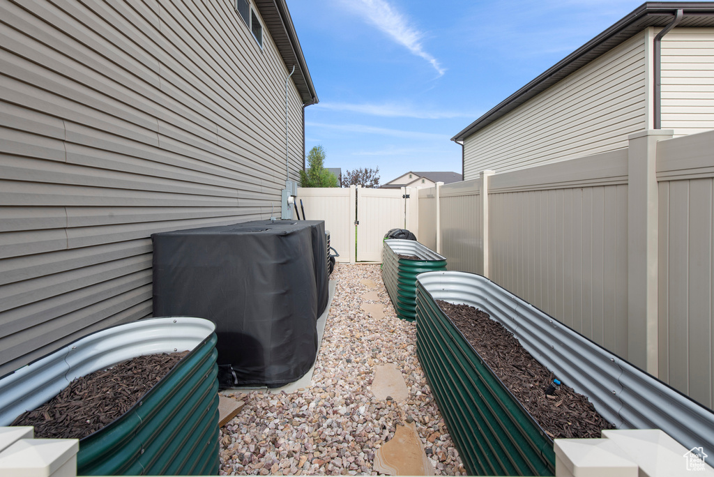 View of property exterior featuring a fenced backyard