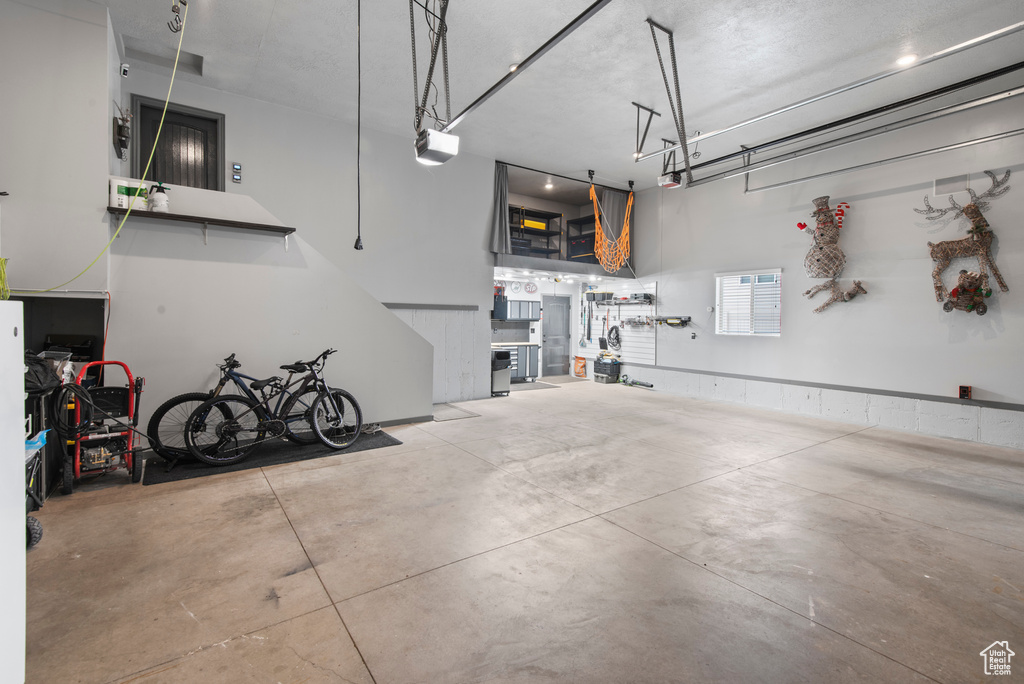 Garage featuring a garage door opener