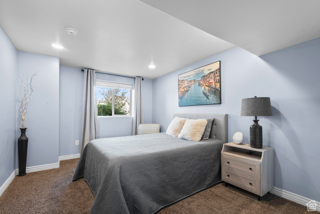 Bedroom featuring dark colored carpet, baseboards, and recessed lighting