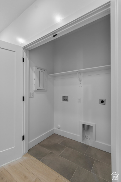 Laundry room featuring gas dryer hookup, electric dryer hookup, washer hookup, and tile patterned floors