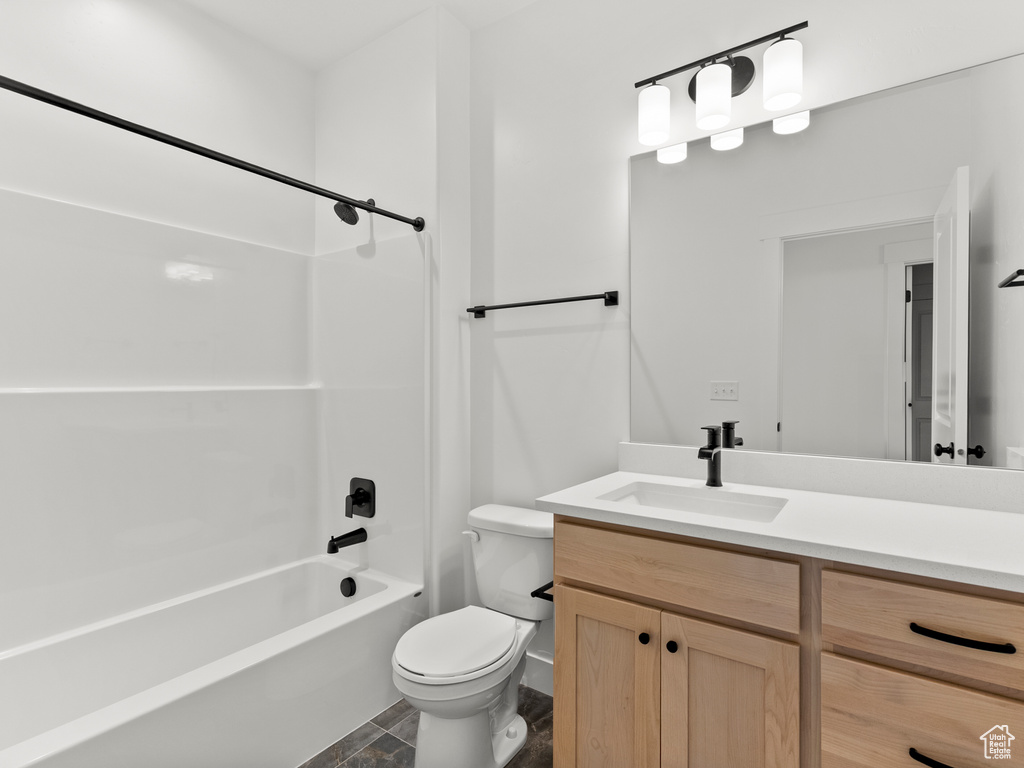 Bathroom with vanity and bathtub / shower combination