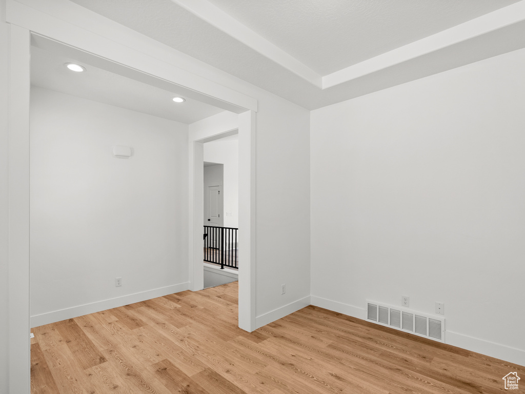 Empty room featuring recessed lighting and light wood-type flooring