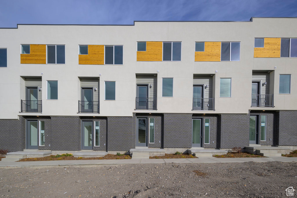 View of front of home featuring stucco siding