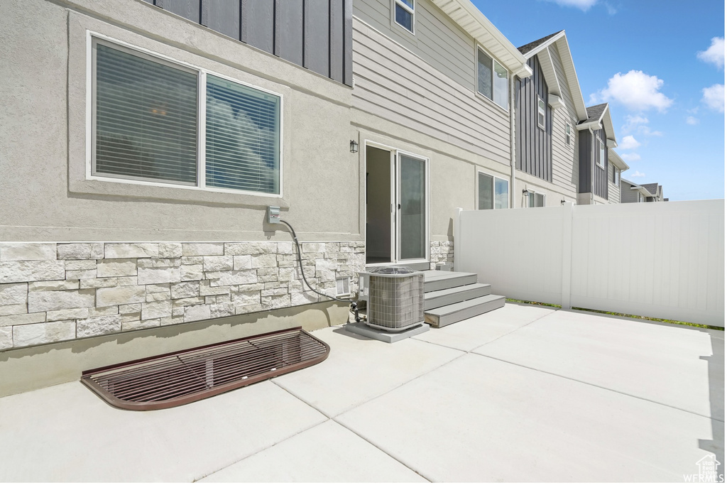 View of patio / terrace with fence and cooling unit