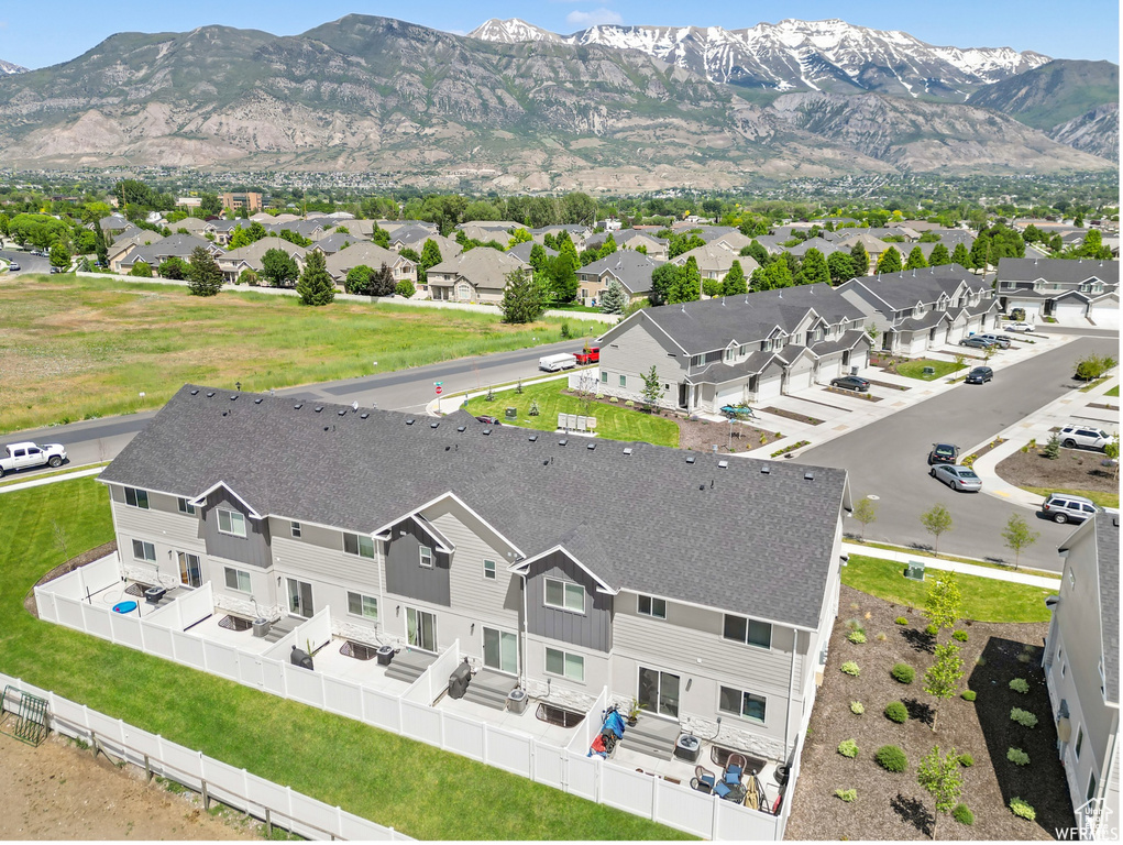 Aerial view of residential area featuring mountains