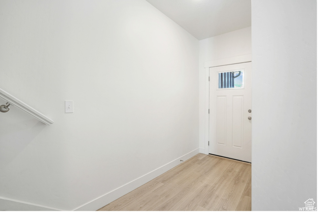 Entryway featuring light wood-style floors and baseboards