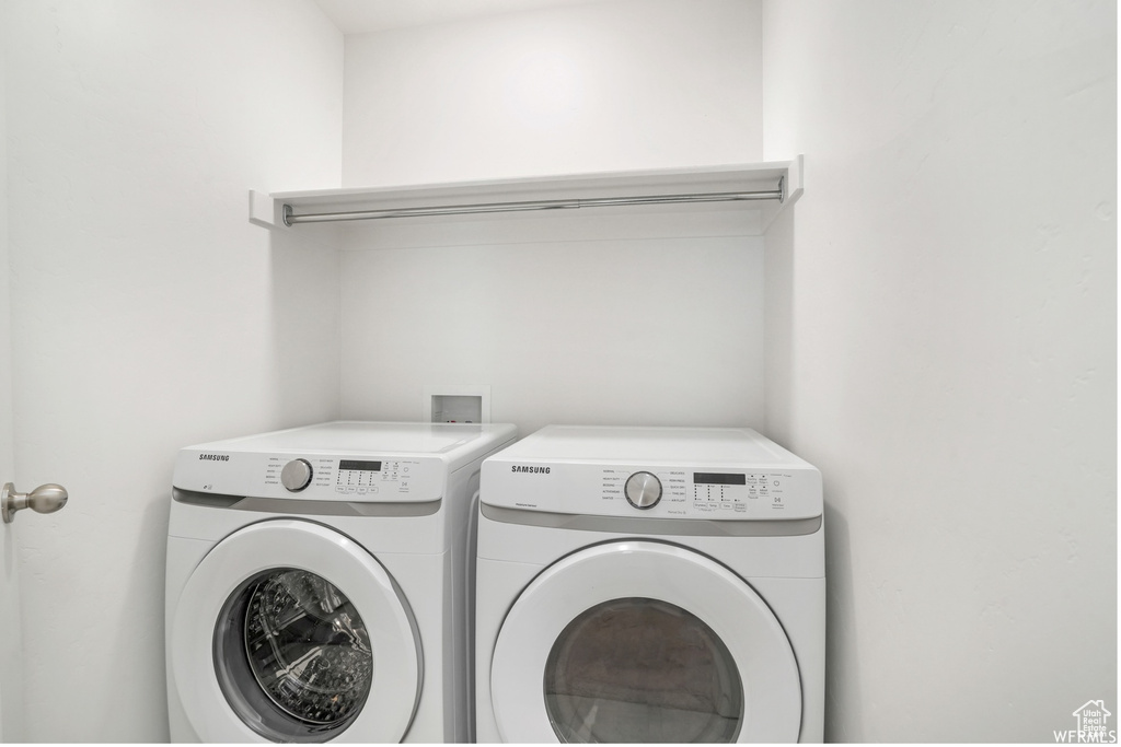 Laundry area featuring independent washer and dryer