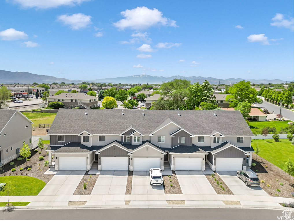 Aerial view of residential area with a mountain backdrop