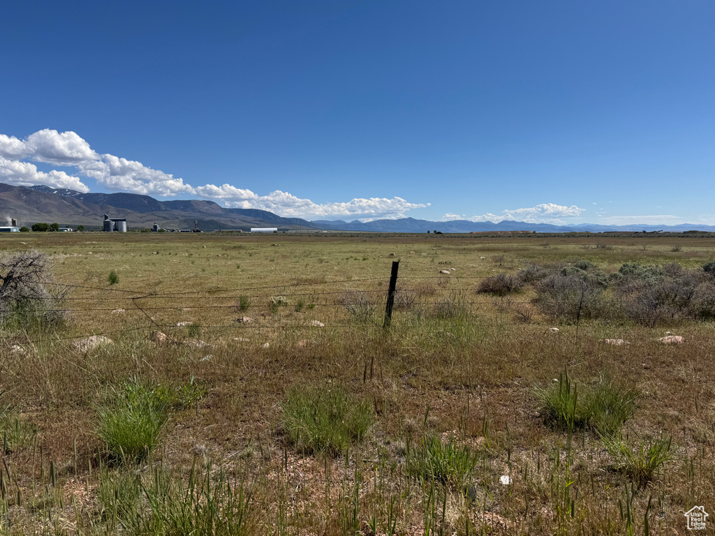 View of mountain backdrop featuring rural landscape