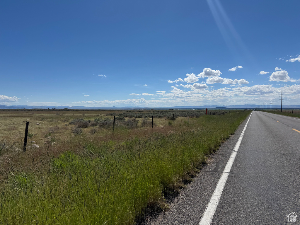 View of asphalt street featuring a rural view