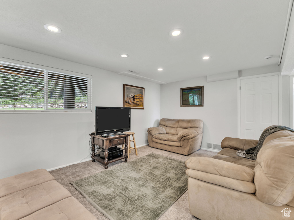 Living room featuring recessed lighting and baseboards