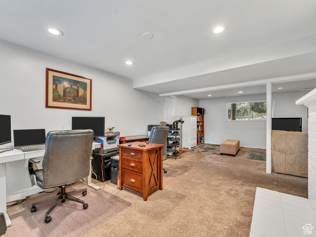 Home office with carpet floors, recessed lighting, and a fireplace