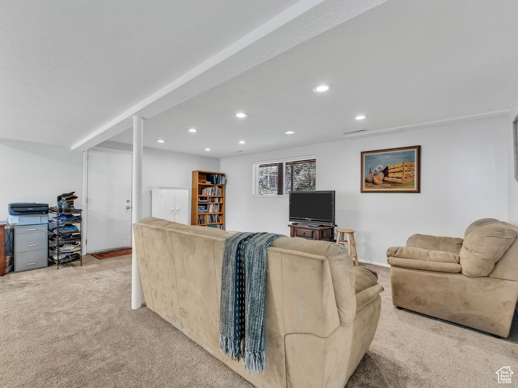 Living room with carpet flooring and recessed lighting