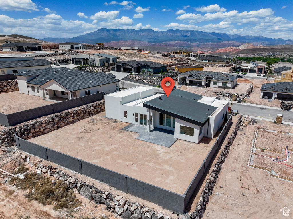 Aerial perspective of suburban area with a mountain backdrop