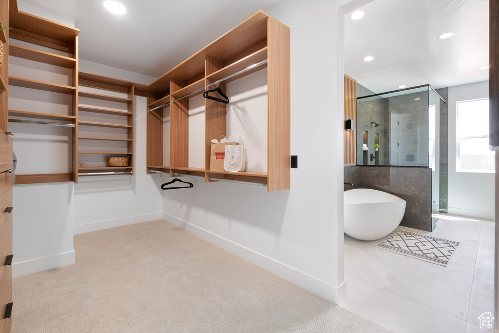Spacious closet with carpet floors