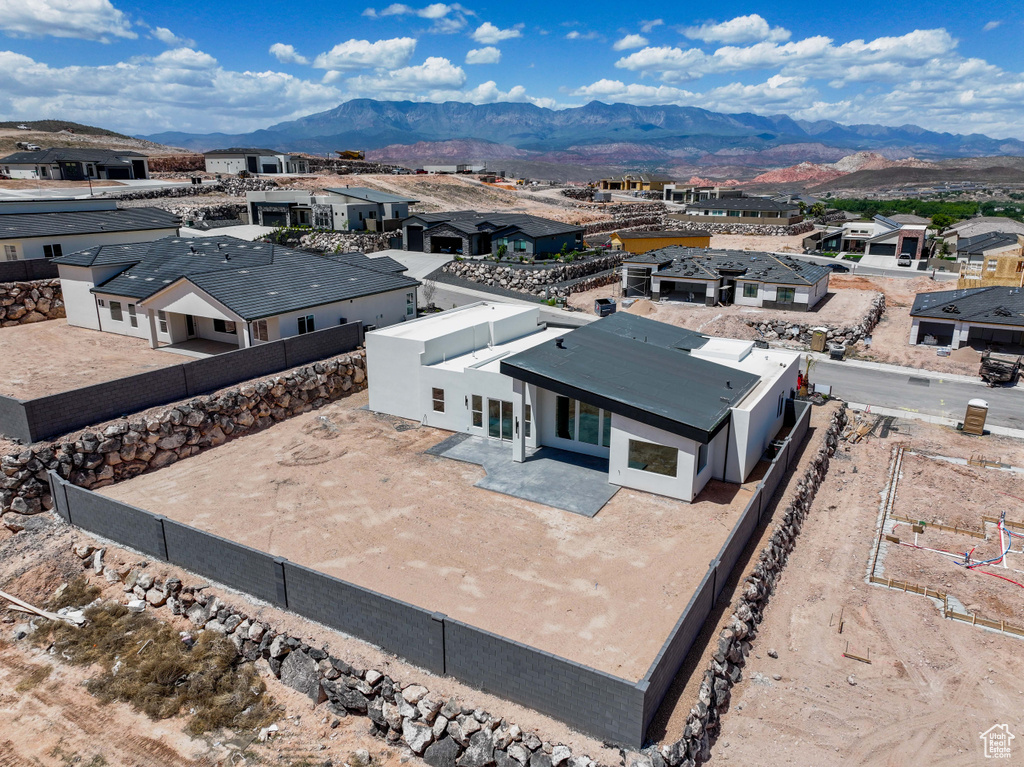 Aerial perspective of suburban area with a mountain backdrop