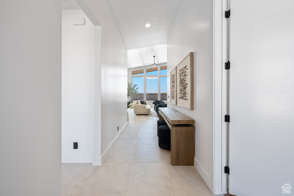 Hall featuring baseboards and recessed lighting