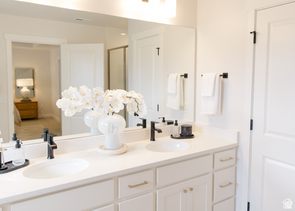 Full bath featuring double vanity