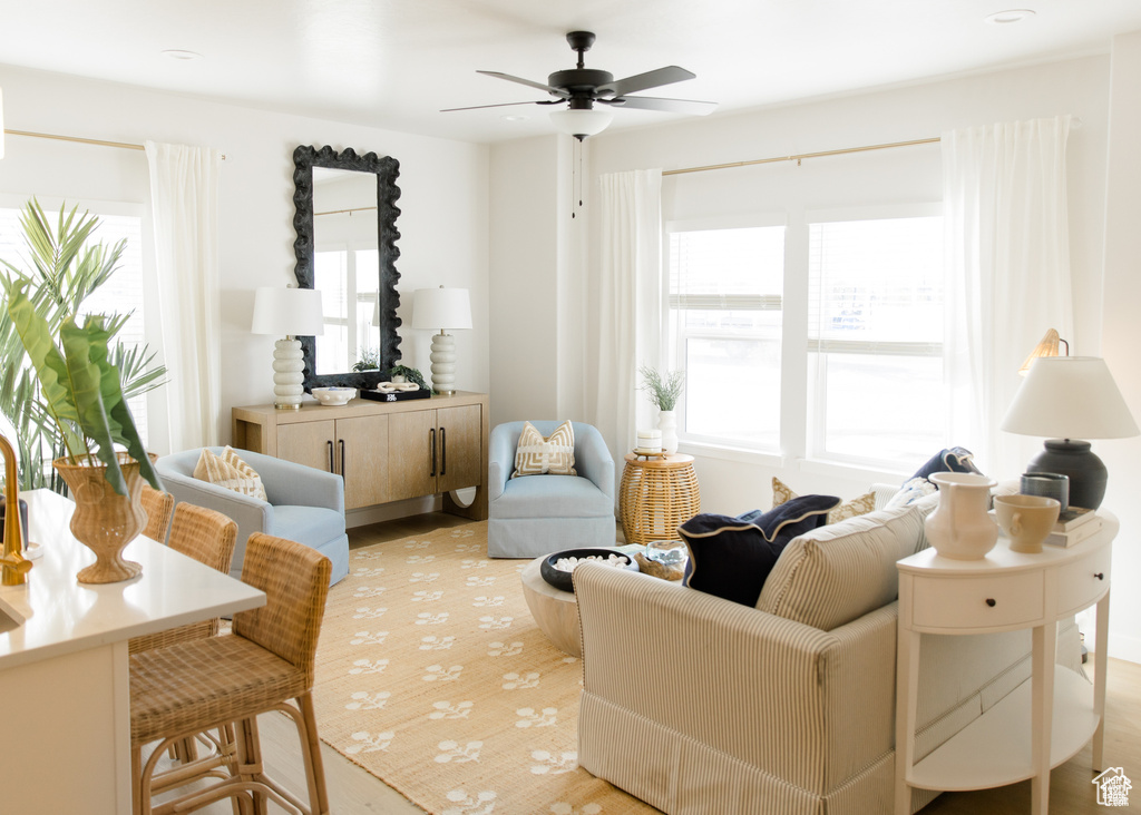 Sitting room featuring a ceiling fan