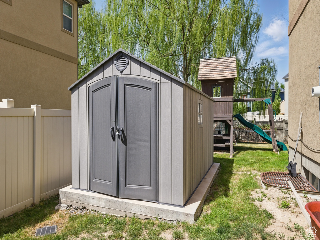 View of shed with a playground