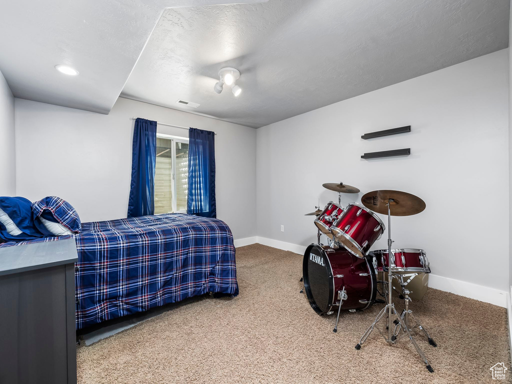 Carpeted bedroom with baseboards