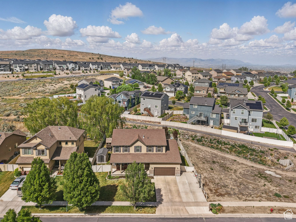 Aerial view of residential area featuring a mountain backdrop