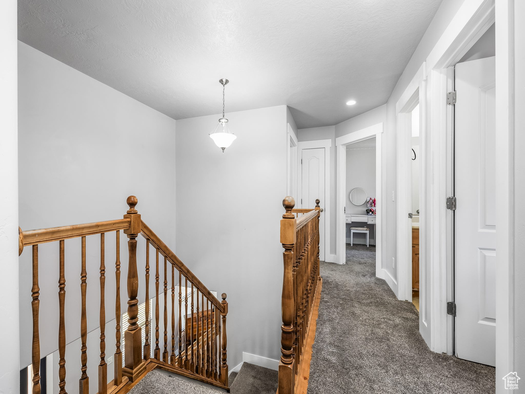 Stairway with carpet floors, recessed lighting, and baseboards