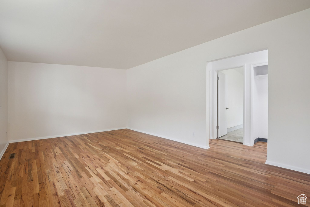 Spare room with light wood finished floors and baseboards