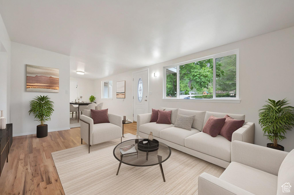 Living area featuring light wood finished floors and baseboards