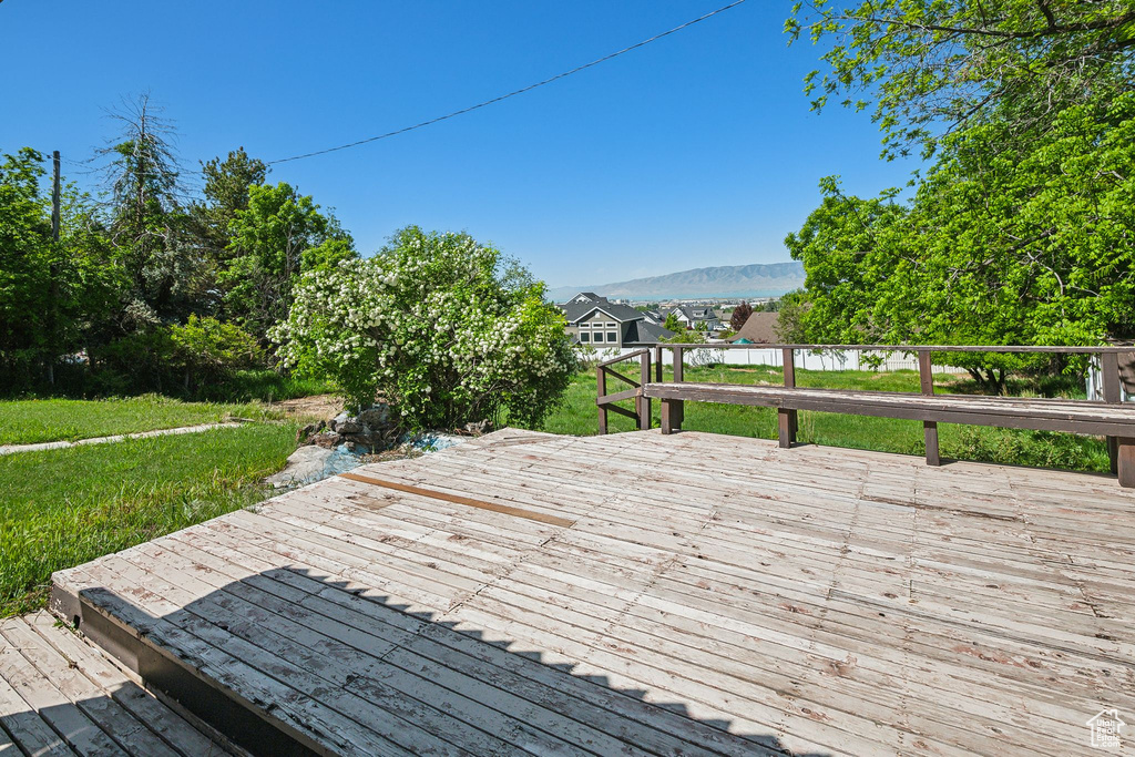 Wooden deck featuring a mountain view
