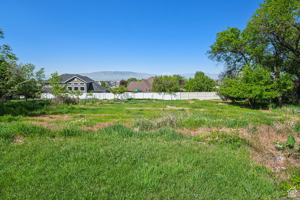 View of yard featuring fence