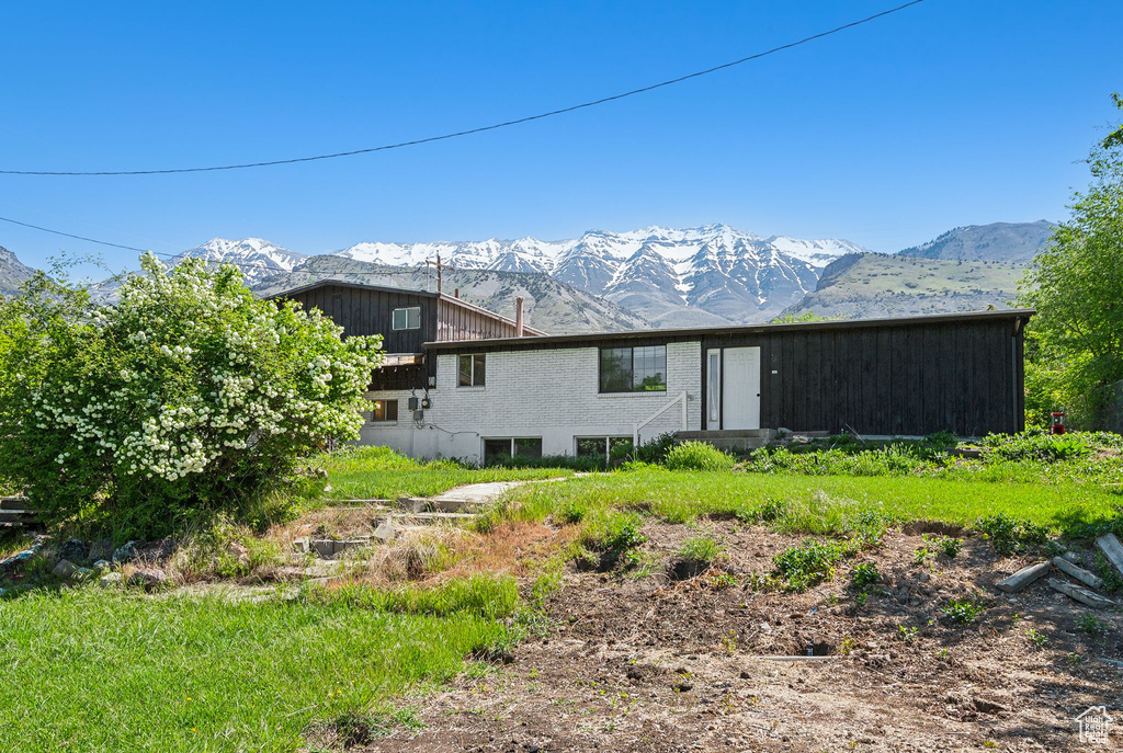 Rear view of house with a mountain view