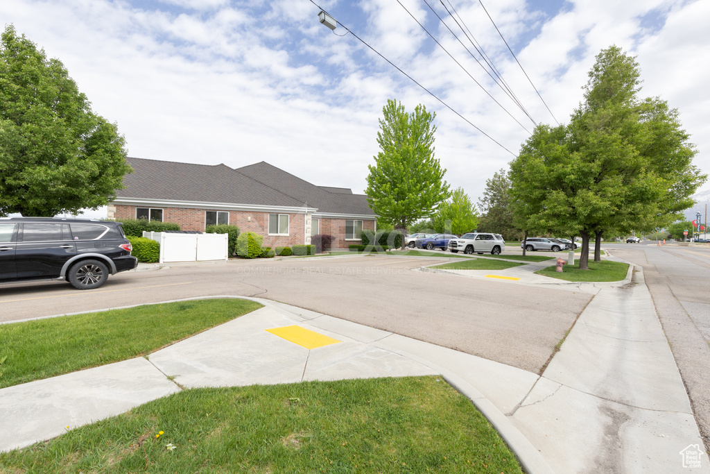 View of asphalt street with sidewalks and curbs