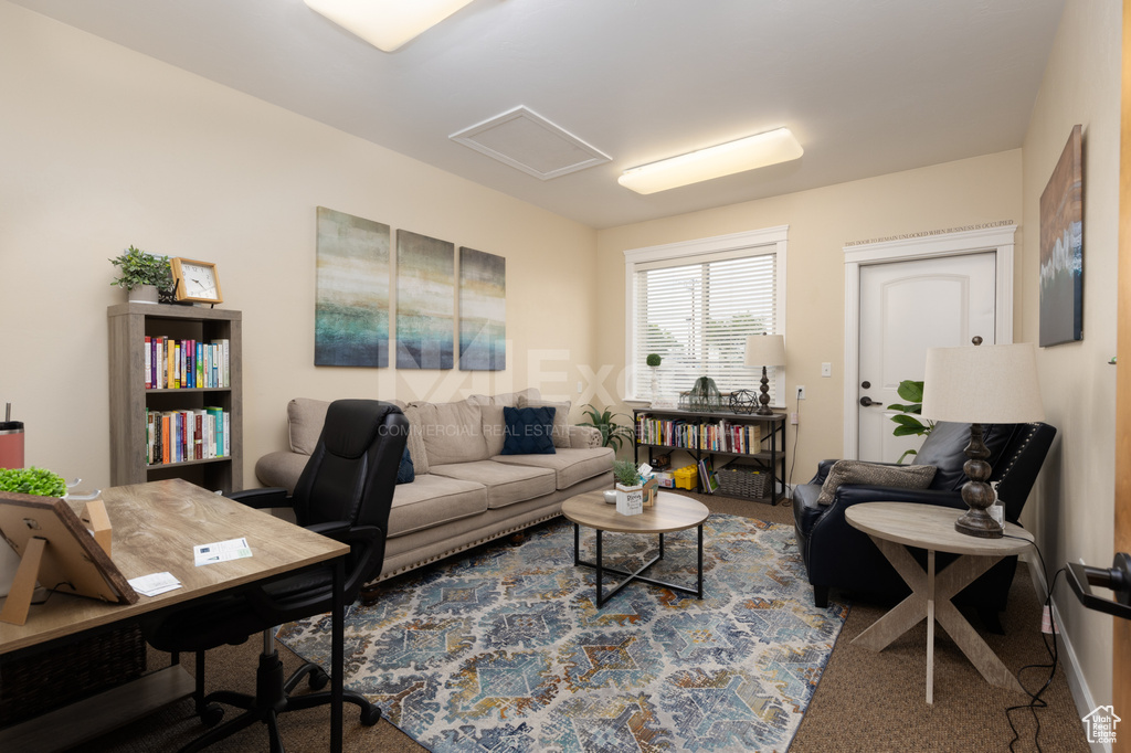 Home office with attic access and carpet floors