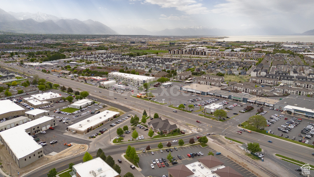 Aerial view of property\'s location featuring a mountainous background