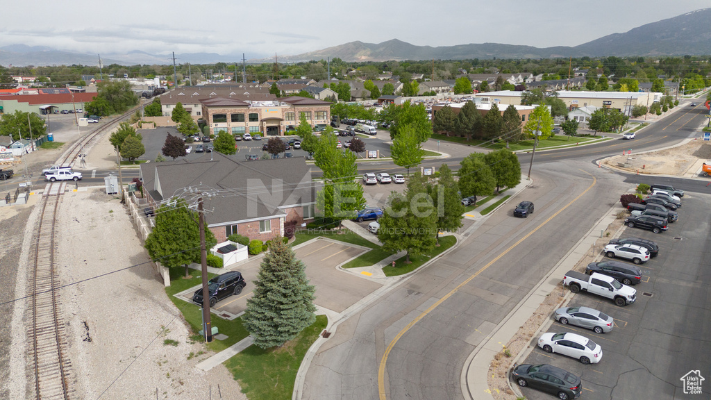 Aerial perspective of suburban area featuring a mountain backdrop