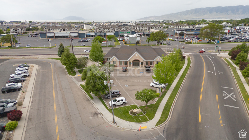 Aerial perspective of suburban area with a mountainous background