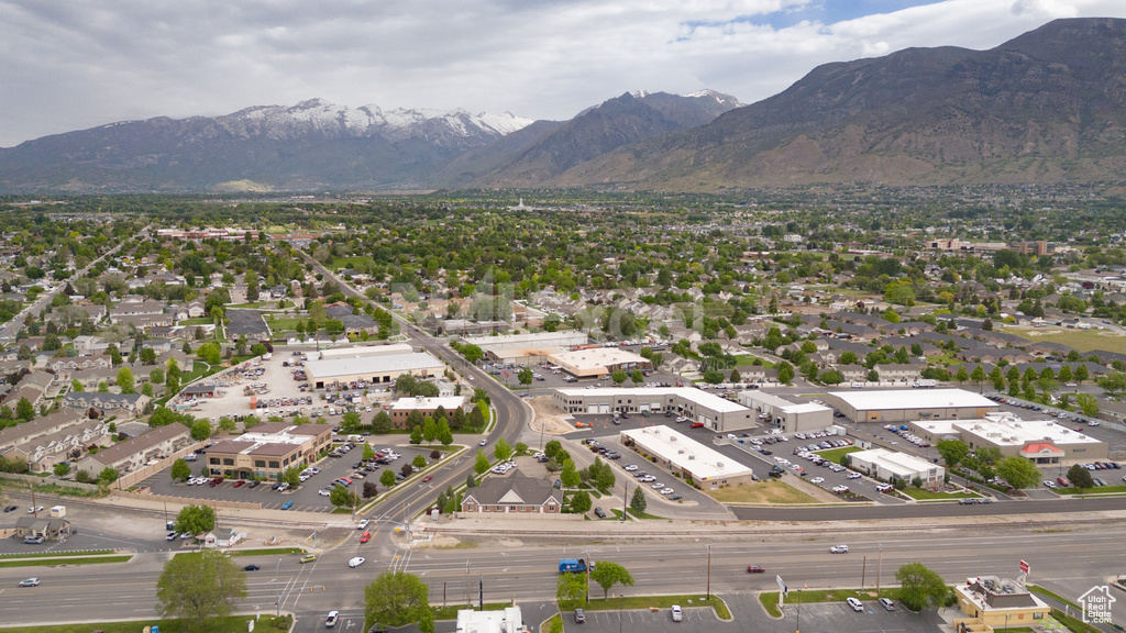 Aerial overview of property\'s location featuring a mountainous background