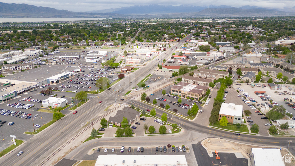 Aerial view of property\'s location featuring a mountainous background