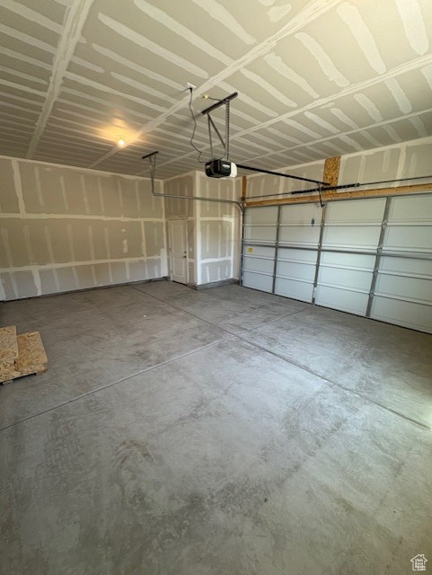 Garage featuring a garage door opener