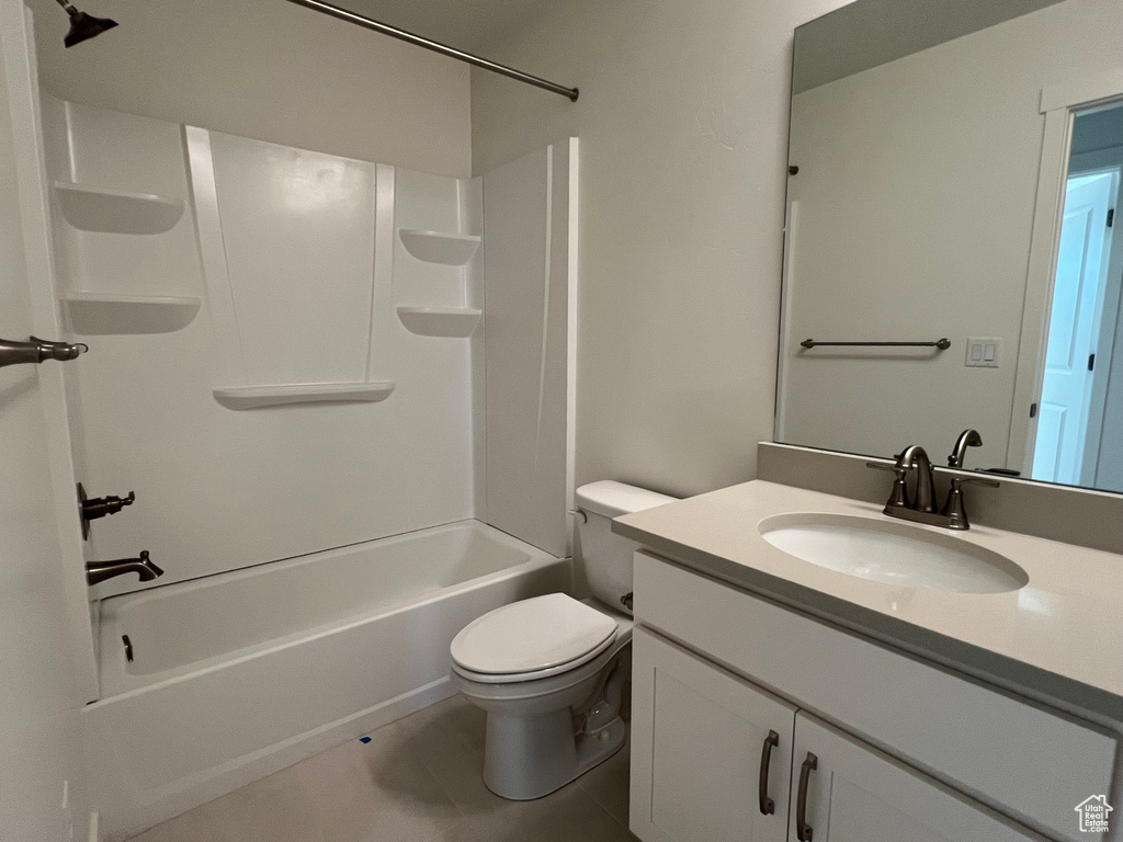 Full bathroom with vanity, bathing tub / shower combination, and tile patterned floors