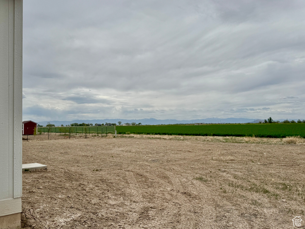 View of yard with a view of rural / pastoral area and a mountain view